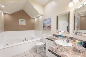 Relax and refresh in this spa-like bathroom featuring a luxurious tub. Your oasis awaits!