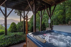 Soak in the private hot tub and take in the beautiful vast mountain views