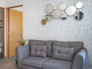 Inside you can unwind with a cozy sofa