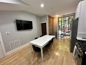 Fully stocked kitchen with dining area seating 6 and a 55" UHD Smart TV. Please note, spiral staircase leading to lower level may not be big enough for large individuals.