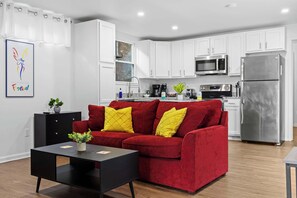 Living Room: Enjoy modern comforts in the eco-friendly ambiance of our home