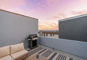 Experience the coastal sunsets from the comfort of your modern beach home retreat