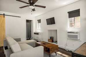 Living area with cozy seating and Smart TV