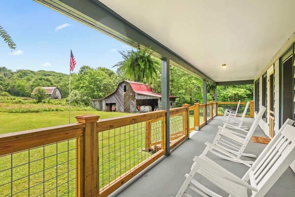Bask in serene ambiance and Savor your morning coffee in our porch with a stunning view of the working farm of our lovely home