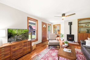 Unwind and embrace the welcoming comfort of the living room, where a plush couch and a snug gas fireplace await after a day of exploration