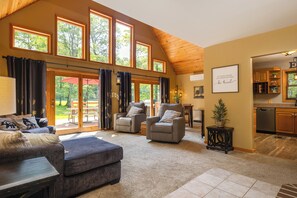 Panoramic views of the front deck and large, open lush lawn. 