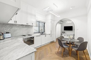 You’ll find everything that’s needed in the modern, streamlined kitchen to prepare meals, plus a dishwasher for easy clean-up. 
