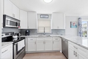 A chef's dream kitchen, fully stocked and loaded.
