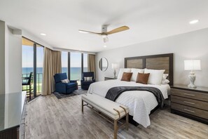 King bed in master overlooking the water with balcony access