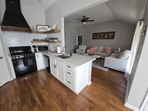 Open concept fully stocked kitchen perfect for entertaining!
