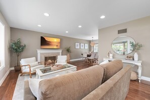 Living Room: Comfortable seating in front of the 65" TV and fireplace