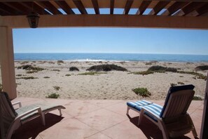 Beach Patio right on the sand. Only a few yards from the tide.