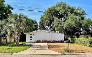 Beachy chic exterior with plenty space for parking 