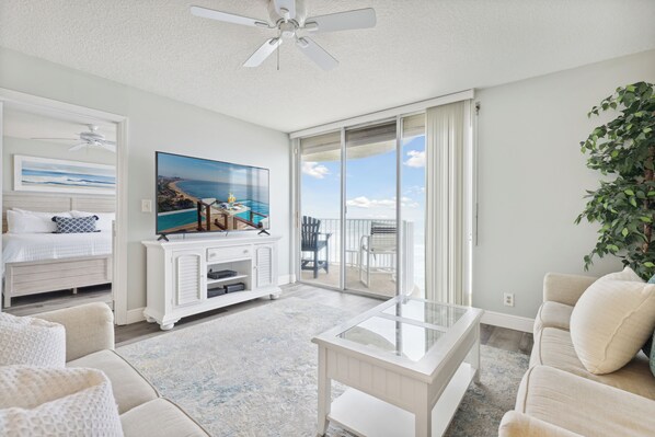 Living room and balcony with direct ocean views