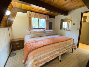 Master bedroom on the main level with a King size bed.