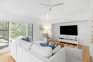 Hardwood floors throughout the main living and bedroom areas.  Floor to ceiling windows in the living areas.