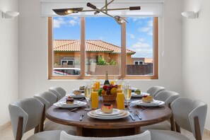 This stylish dining area is the perfect setting for hosting dinner parties and special occasions, featuring a beautifully appointed table, comfortable seating, and a warm ambiance, creating an atmosphere of sophistication and refinement.