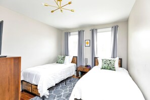 WIth two twin beds, this third bedroom is perfect for kids or best friends, complete with a Roku TV for entertainment.