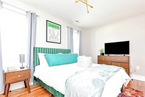Secondary Bedroom with a Queen bed: Offers an ensuite bathroom with a shower tub combo and a Roku TV for a cozy retreat.