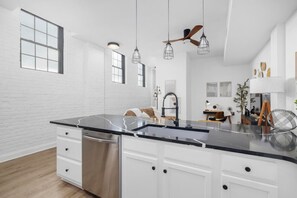 From coffee to dinner, this modern kitchen is designed for both convenience and style.