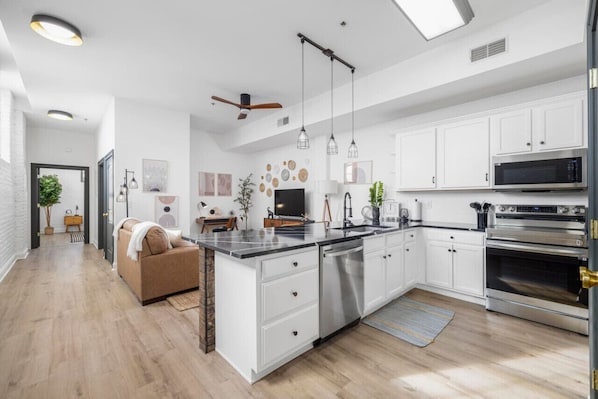Cook your favorite meals in this fully equipped kitchen with all new appliances and stylish finishes.