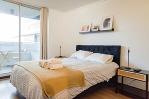 Relax in this stylish bedroom with a private balcony, perfect for enjoying morning coffee or evening sunsets.