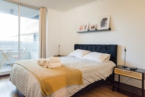 Relax in this stylish bedroom with a private balcony, perfect for enjoying morning coffee or evening sunsets.