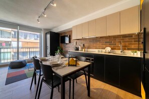 Stylish kitchen with modern amenities and a cozy dining area, perfect for enjoying meals with a view.