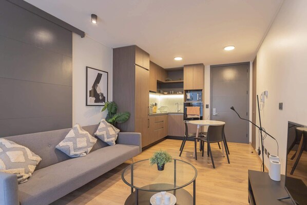 Chic open-plan living space with modern amenities, perfect for a cozy stay in the heart of the city.