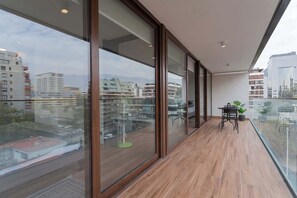 Enjoy breathtaking city and mountain views from your private balcony, perfect for relaxing with a morning coffee or evening drink.