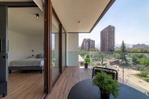 Enjoy stunning city views from your private balcony, perfect for morning coffee or evening relaxation in this chic studio apartment.