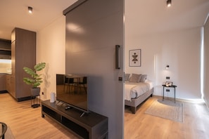 Experience modern comfort in this stylish studio with a sleek design, cozy sleeping area, and contemporary amenities.