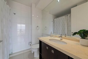 Bright and modern bathroom with elegant finishes and thoughtful touches for a refreshing stay.
