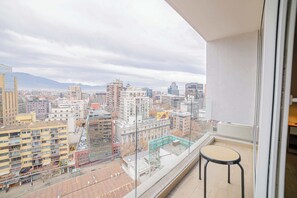 Enjoy breathtaking city views from your private balcony, perfect for a relaxing morning coffee.