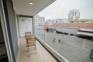 Enjoy city views from your private balcony, perfect for morning coffee or evening relaxation.