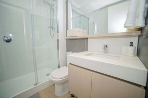 Experience modern comfort in this sleek bathroom with a spacious shower and elegant fixtures.