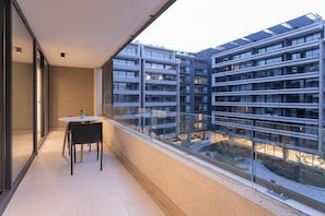 Relax on your private balcony with stunning urban views, perfect for morning coffee or evening relaxation.