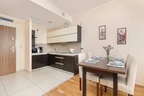 Living room with kitchenette.