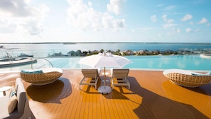 Unwind at the Hilton’s exclusive rooftop infinity pool—yours to enjoy with every stay