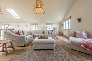 Garden Cottage, Brancaster: Sitting room with wood burning stove and comfortable seating