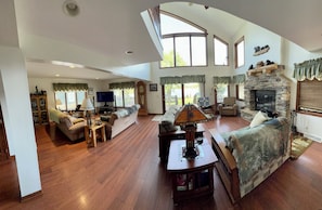 Family room and fireplace facing lake