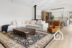 The home boasts a generous open-plan living area, opening onto expansive deck