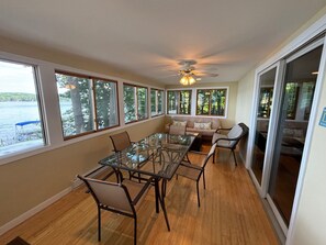Sun porch offers dining, seating and views