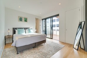 Master bedroom featuring king bed, high quality linen, ensuite bathroom and direct access to the private terrace