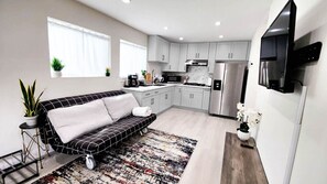 Make yourself at home in our cozy living room, complete with a Smart TV and modern amenities for a relaxing stay.