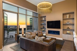 Living room featuring a 65" 4K UHD TV