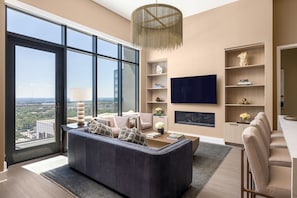 Living room featuring a 65" 4K UHD TV