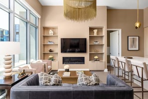 Living room featuring a 65" 4K UHD TV