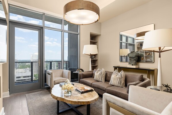 Living room featuring a 65" 4K UHD TV