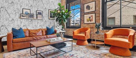 Relax in the living area with a smart TV, stylish seating, and a sleeper sofa for extra guests. Perfect for families or group stays in New Orleans, this inviting space is ideal for movie nights or recharging after a day in the city.